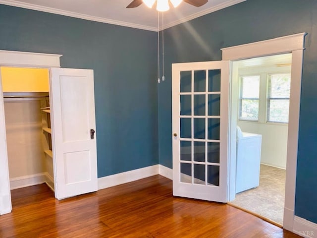 306 Oakridge Blvd, Lynchburg, VA 24502 - unfurnished bedroom with crown molding, baseboards, washer / dryer, and wood finished floors