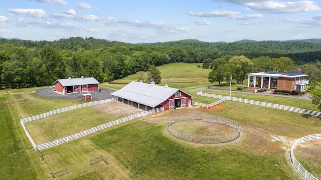bird's eye view with a view of trees and a rural view