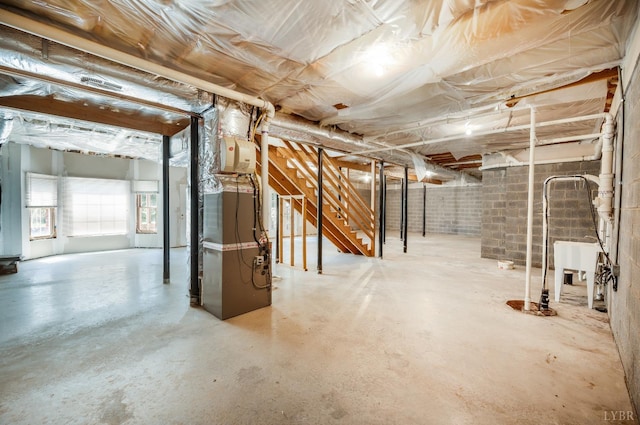 1348 Lake Shore Dr, Forest, VA 24551 - basement with a sink, heating unit, and stairs