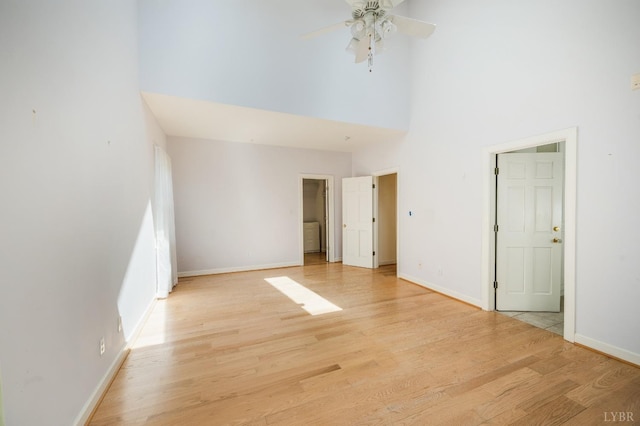 1348 Lake Shore Dr, Forest, VA 24551 - unfurnished bedroom with a high ceiling, light wood-type flooring, and baseboards
