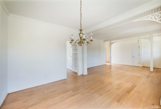 1348 Lake Shore Dr, Forest, VA 24551 - unfurnished room with arched walkways, a chandelier, light wood finished floors, crown molding, and baseboards