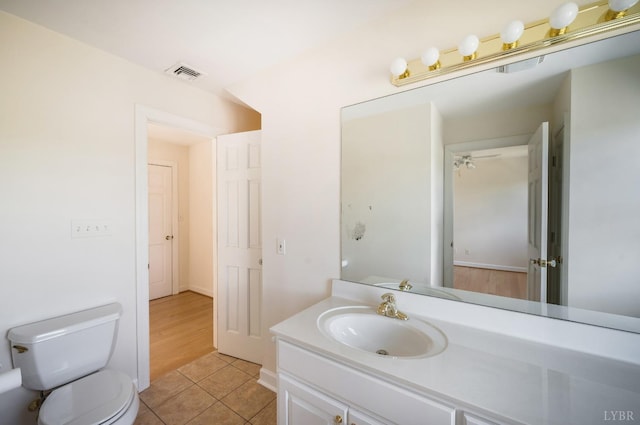 1348 Lake Shore Dr, Forest, VA 24551 - bathroom featuring vanity, toilet, and tile patterned floors