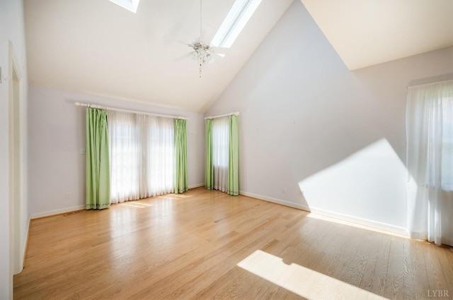 1348 Lake Shore Dr, Forest, VA 24551 - unfurnished living room with a skylight, high vaulted ceiling, wood finished floors, and baseboards