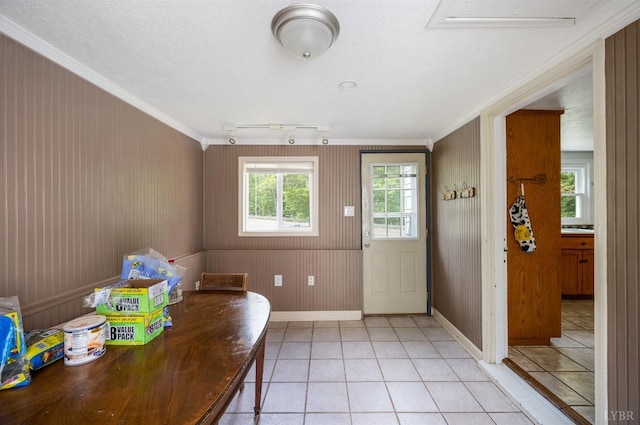 906 Elon Rd, Madison Heights, VA 24572 - foyer entrance featuring ornamental molding, light tile patterned flooring, baseboards, wooden walls, and a textured ceiling