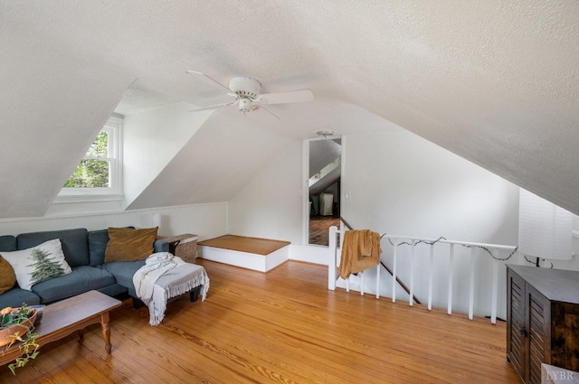 906 Elon Rd, Madison Heights, VA 24572 - living area featuring an upstairs landing, a textured ceiling, wood finished floors, vaulted ceiling, and ceiling fan