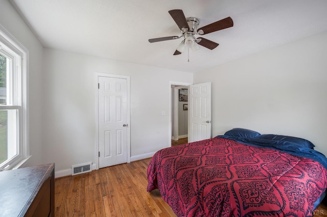 906 Elon Rd, Madison Heights, VA 24572 - bedroom with wood finished floors, baseboards, and ceiling fan