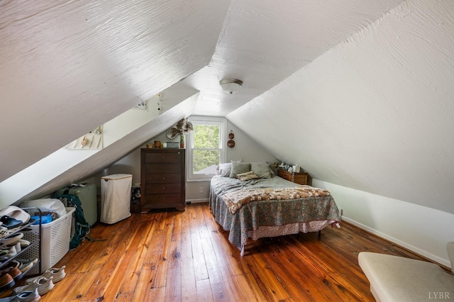 906 Elon Rd, Madison Heights, VA 24572 - bedroom with wood-type flooring, vaulted ceiling, and baseboards