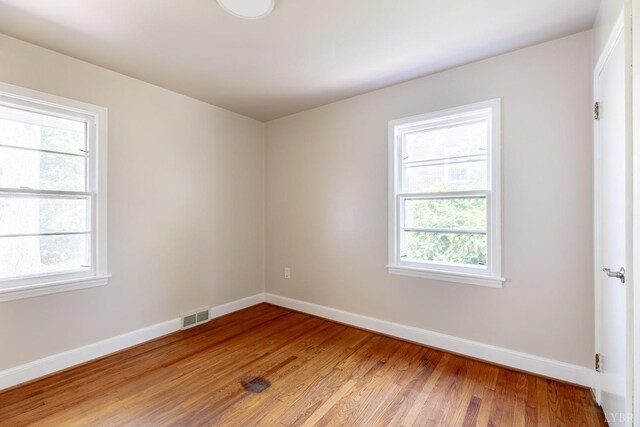 336 Biltmore Ave, Lynchburg, VA 24502 - empty room with light wood-type flooring, visible vents, baseboards, and a healthy amount of sunlight