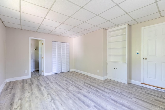 336 Biltmore Ave, Lynchburg, VA 24502 - unfurnished bedroom featuring light wood finished floors, visible vents, baseboards, and a paneled ceiling