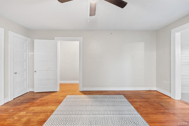 507 Henry St, Gretna, VA 24557 - unfurnished bedroom featuring light wood finished floors, baseboards, and ceiling fan