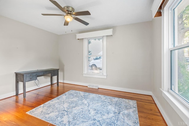 507 Henry St, Gretna, VA 24557 - spare room with ceiling fan, baseboards, visible vents, and wood finished floors