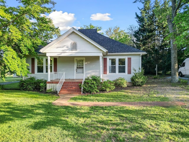 507 Henry St, Gretna, VA 24557 - bungalow-style house featuring a front yard, a porch, and roof with shingles