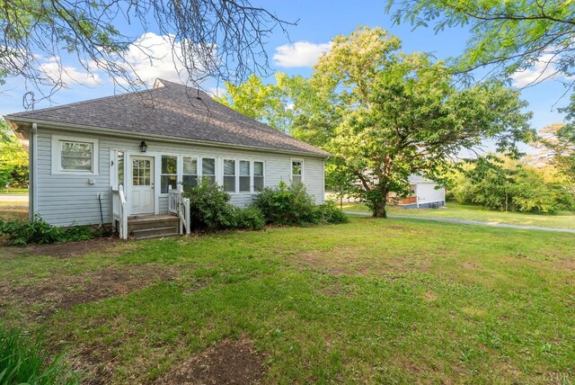 507 Henry St, Gretna, VA 24557 - back of house featuring a yard and a shingled roof