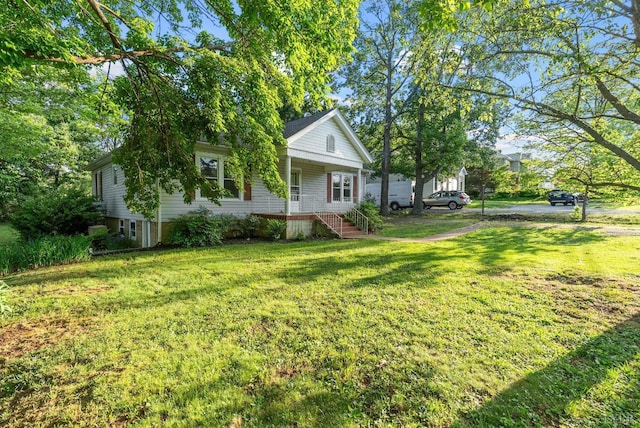 507 Henry St, Gretna, VA 24557 - view of front of home with covered porch and a front lawn