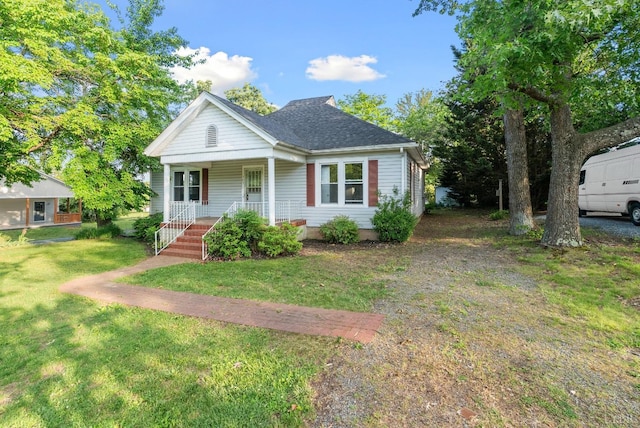 507 Henry St, Gretna, VA 24557 - bungalow-style home with a front lawn, a shingled roof, and a porch