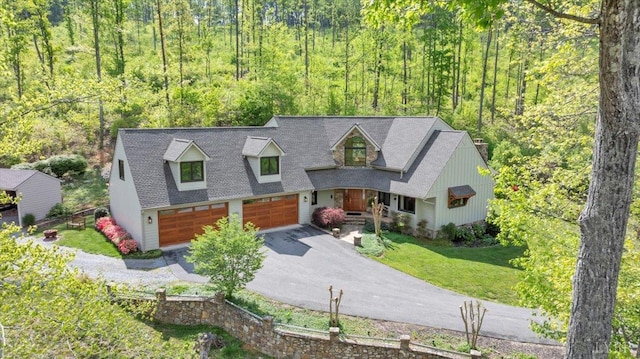 122 Gravelly Ridge Rd, Troutville, VA 24175 - view of front of property featuring a front yard, a wooded view, aphalt driveway, and a garage