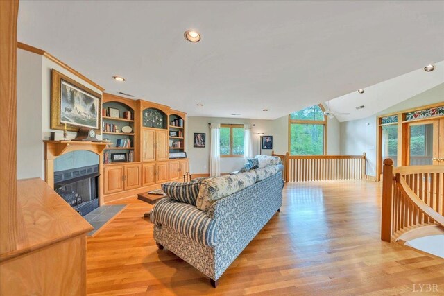 122 Gravelly Ridge Rd, Troutville, VA 24175 - living area with light wood finished floors, a fireplace with flush hearth, baseboards, lofted ceiling, and recessed lighting
