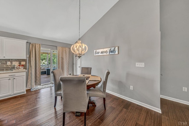dining area with high vaulted ceiling, a chandelier, baseboards, and dark wood-style floors