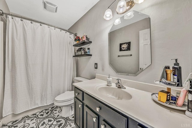 full bath with toilet, visible vents, a shower with shower curtain, tile patterned flooring, and vanity