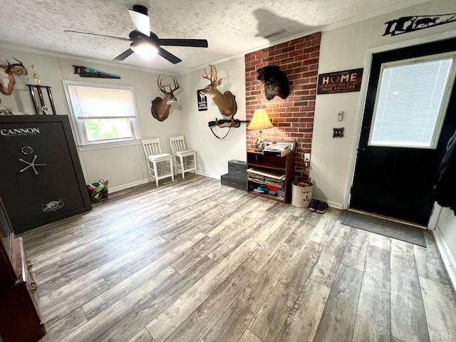 139 Abbitts Dr, Madison Heights, VA 24572 - entryway with a textured ceiling, ornamental molding, wood finished floors, a ceiling fan, and baseboards