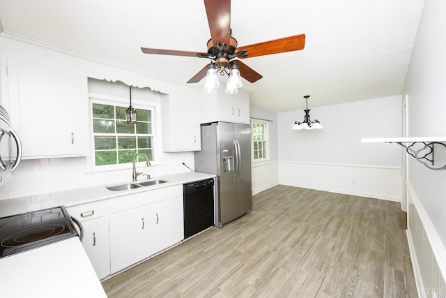 kitchen featuring ceiling fan with notable chandelier, a sink, black dishwasher, stainless steel fridge with ice dispenser, and white cabinetry