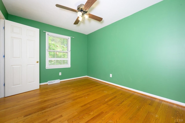 unfurnished bedroom with ceiling fan, baseboards, visible vents, and light wood-style floors