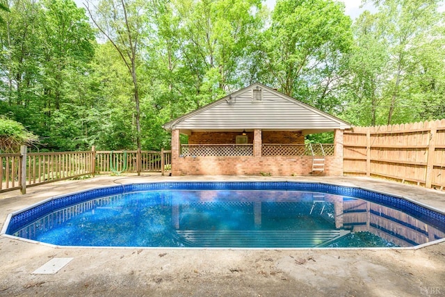 view of pool featuring a fenced in pool and a fenced backyard