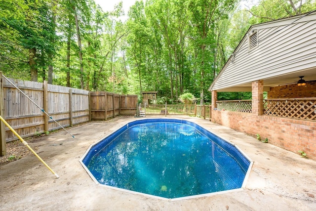 view of pool with a patio, a fenced in pool, ceiling fan, and a fenced backyard