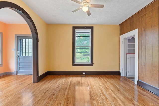 600 9th St, Altavista, VA 24517 - unfurnished room featuring baseboards, light wood-style flooring, ceiling fan, and a textured ceiling