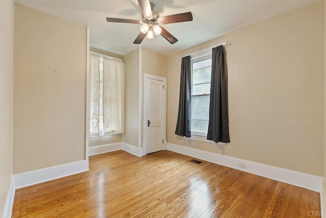 600 9th St, Altavista, VA 24517 - empty room featuring visible vents, wood finished floors, baseboards, and ceiling fan