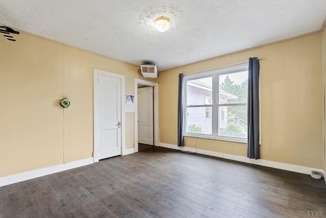 600 9th St, Altavista, VA 24517 - unfurnished room with a textured ceiling, baseboards, and dark wood-style floors