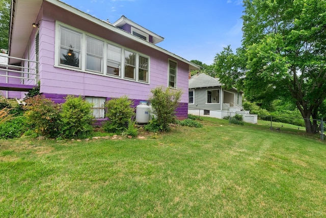 600 9th St, Altavista, VA 24517 - rear view of property featuring fence and a lawn