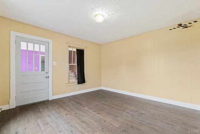 600 9th St, Altavista, VA 24517 - spare room with baseboards, a textured ceiling, and wood finished floors