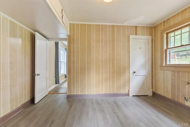 600 9th St, Altavista, VA 24517 - spare room with baseboards, wooden walls, and wood finished floors