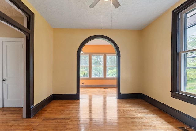 600 9th St, Altavista, VA 24517 - spare room with baseboards, light wood-style flooring, and a textured ceiling