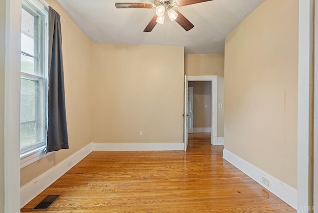 600 9th St, Altavista, VA 24517 - unfurnished room with a wealth of natural light, visible vents, a ceiling fan, and light wood-style floors