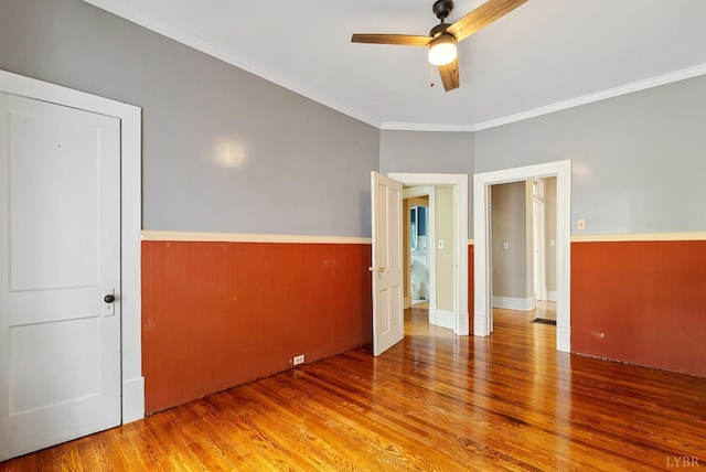 600 9th St, Altavista, VA 24517 - unfurnished bedroom featuring a ceiling fan, ornamental molding, and wood finished floors