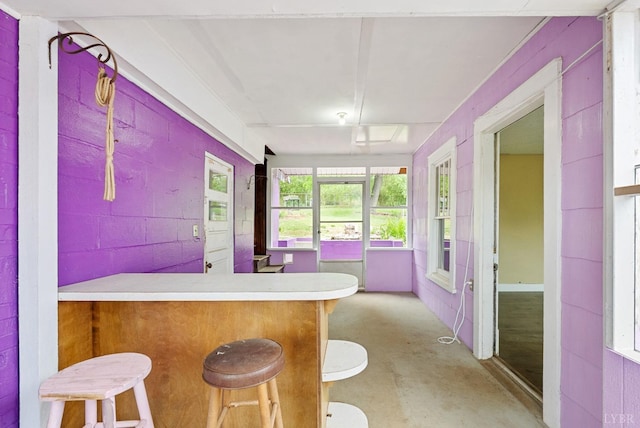 600 9th St, Altavista, VA 24517 - interior space with a peninsula, concrete flooring, and a breakfast bar area