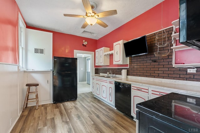 600 9th St, Altavista, VA 24517 - kitchen featuring a sink, black appliances, visible vents, light countertops, and a ceiling fan