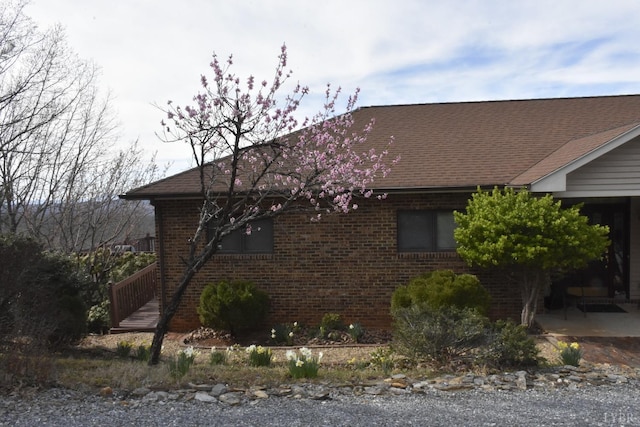885 Cresthill Rd, Lynchburg, VA 24504 - view of side of home with brick siding, a patio area, and a shingled roof