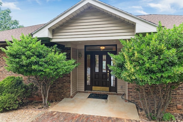 885 Cresthill Rd, Lynchburg, VA 24504 - doorway to property with brick siding and a shingled roof
