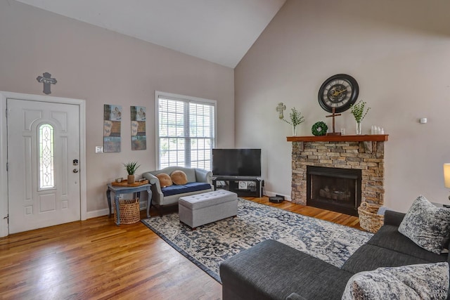 22 Semmes Ct, Rustburg, VA 24588 - living room with high vaulted ceiling, wood finished floors, and a stone fireplace