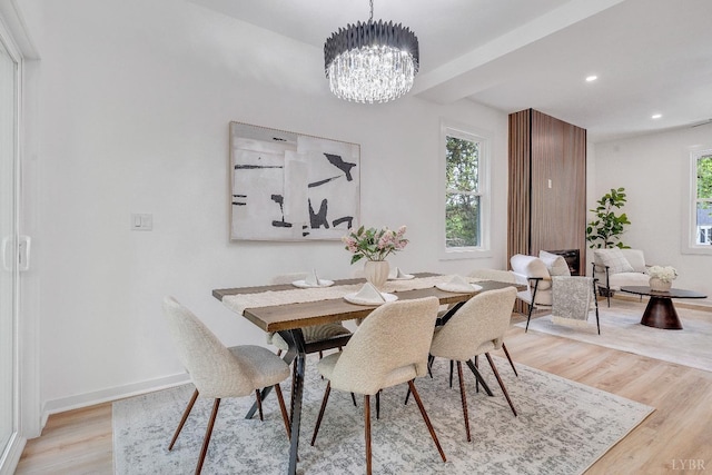 dining space with a chandelier, light wood finished floors, baseboards, recessed lighting, and beamed ceiling