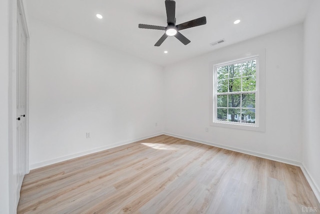 empty room with light wood finished floors, recessed lighting, baseboards, and ceiling fan