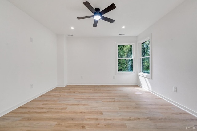unfurnished room with recessed lighting, ceiling fan, light wood-type flooring, and baseboards