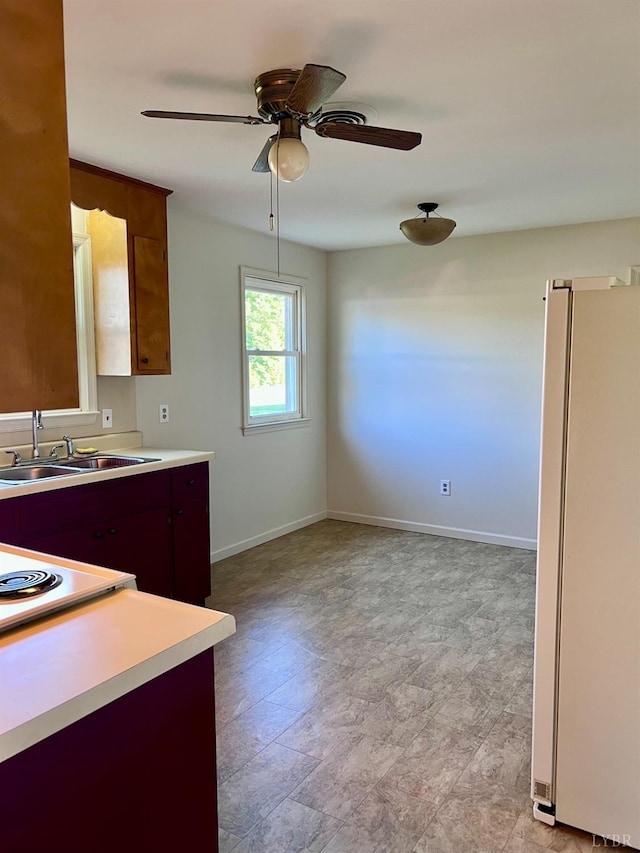 202 Dalton St, Gretna, VA 24557 - kitchen featuring freestanding refrigerator, light countertops, a sink, and a ceiling fan