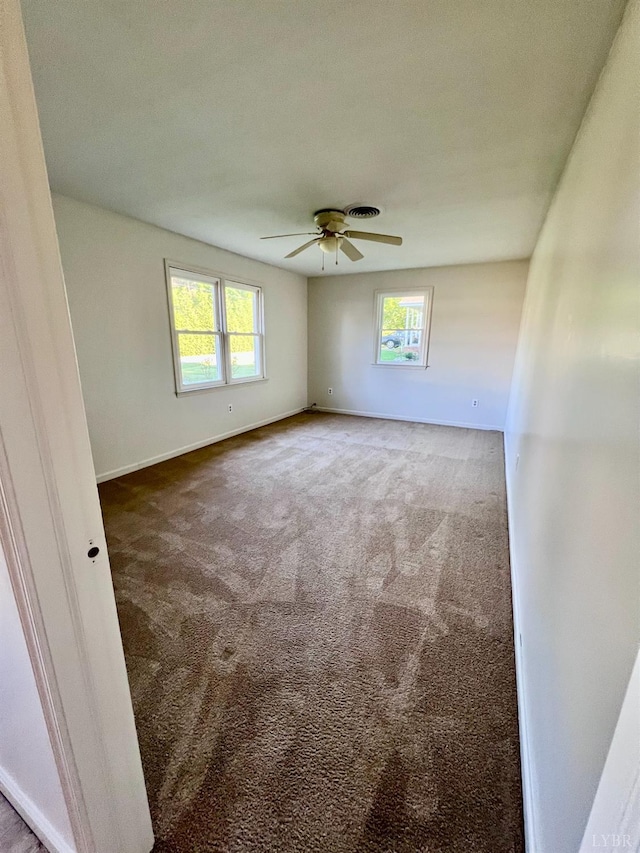 202 Dalton St, Gretna, VA 24557 - carpeted empty room featuring healthy amount of natural light, baseboards, and a ceiling fan