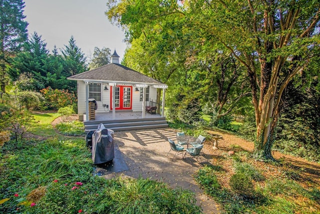 3845 Peakland Pl, Lynchburg, VA 24503 - view of front of home with french doors, an outdoor structure, a patio area, and a deck