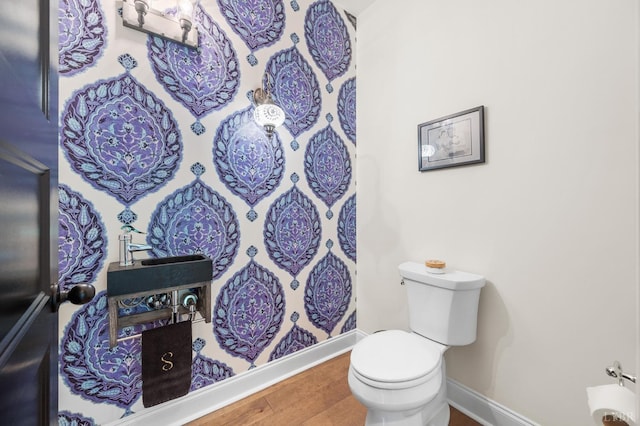 1228 Mill Dam Ln, Forest, VA 24551 - bathroom with toilet, wood finished floors, and baseboards