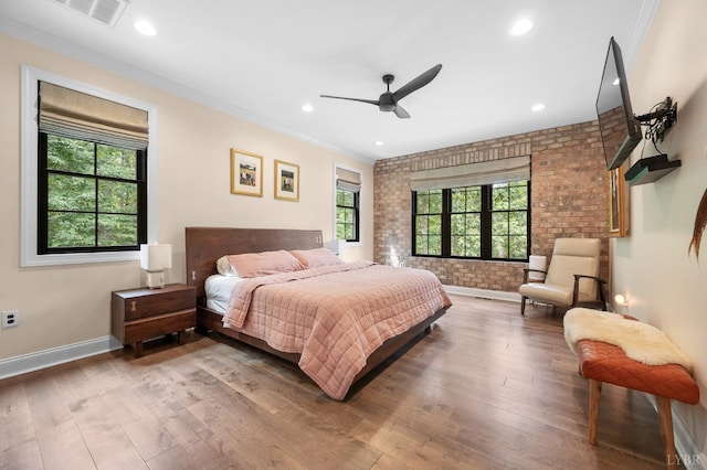 1228 Mill Dam Ln, Forest, VA 24551 - bedroom featuring brick wall, multiple windows, wood finished floors, baseboards, and ornamental molding